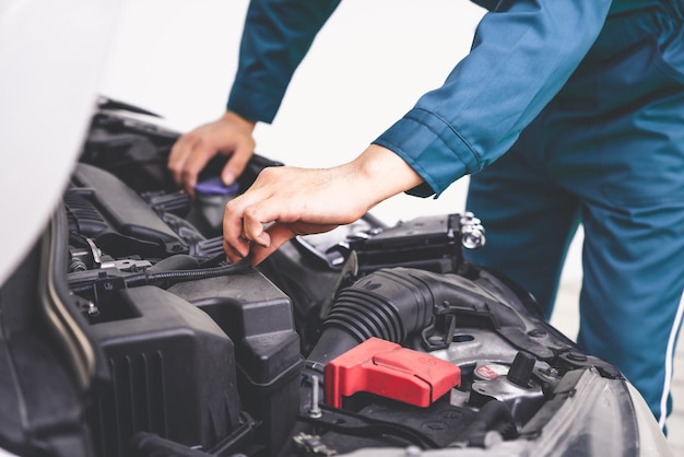 Professional mechanic hand providing car repair and maintenance service