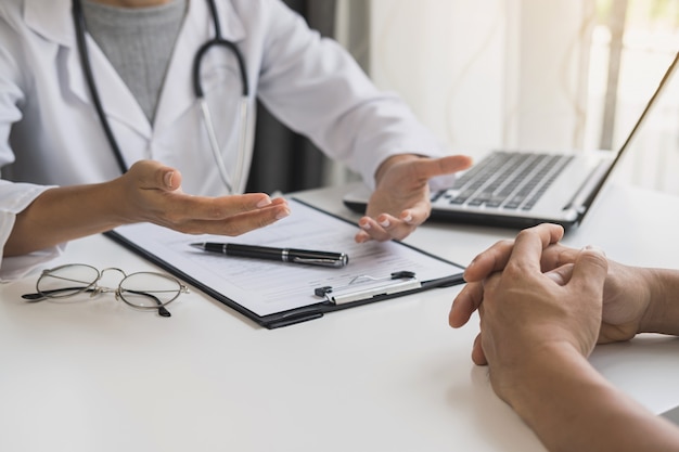 Professional medical doctor consulting her patient at hospital, Healthcare concept