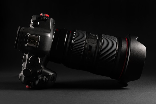 Professional mirrorless camera with premium wide angle lens in dark background