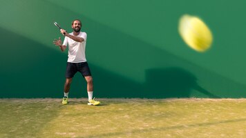 Professional monitor of padel jump to the ball with a black racket sport game