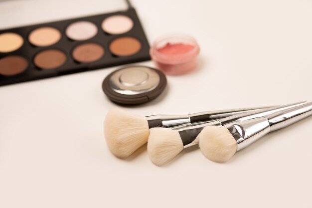 Professional natural brushes and powder contouring kit on a grey background