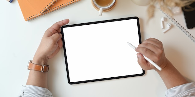 Professional photographer drawing on blank screen tablet 