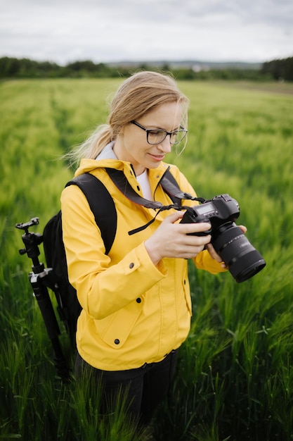 Professional photographer viewing new photos of wheat field