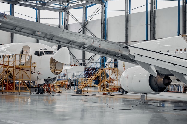 Professional plane expluatation service in big hangar