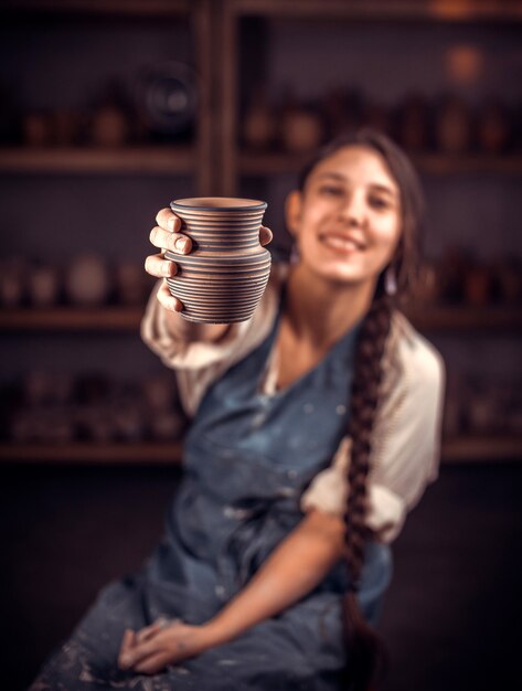 Professional potter at your workplace in art studio. Artisan production.