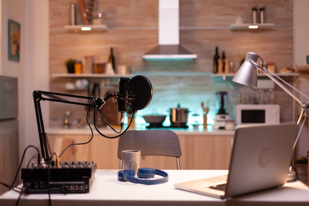 Professional setup for recording podcast in home studio of vlogger. Influencer recording social media content with production microphone. Digital web internet streaming station