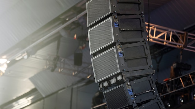 Photo professional sound speakers suspended from the ceiling