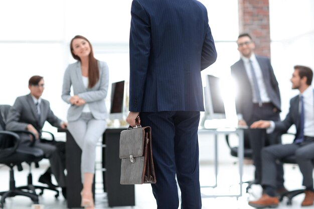 A professional speaking to an audience at a business meeting or conference