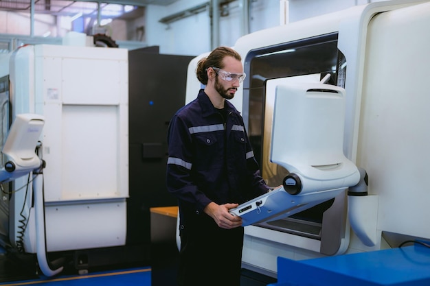 Professional technician checking and repairing part of automatic machine