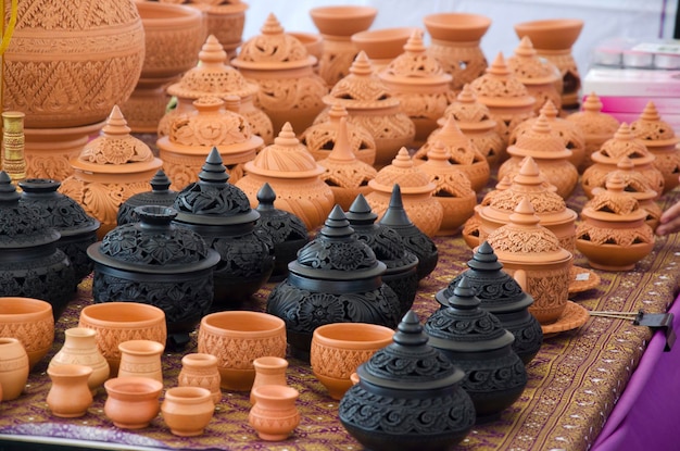 Professional thai old man using mechanic pottery made earthenware for show in traditional culture thai festival at Koh Kret Island in Nonthaburi Thailand