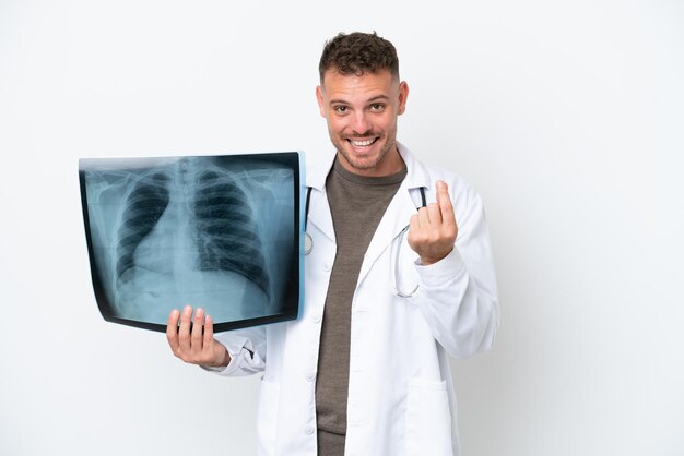 Professional traumatologist caucasian man isolated on white background making money gesture