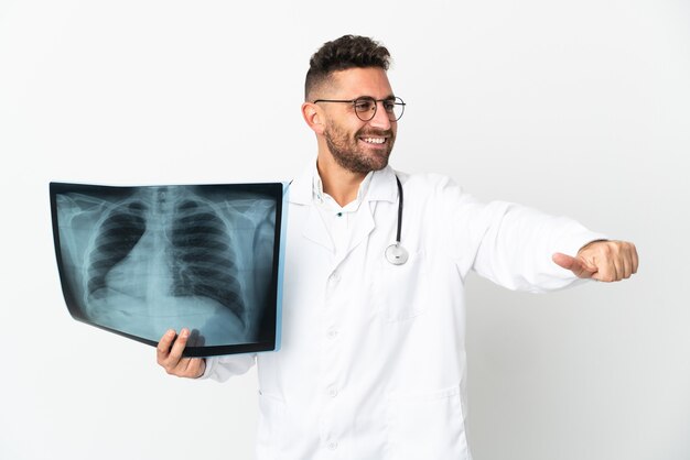 Professional traumatologist isolated on white giving a thumbs up gesture