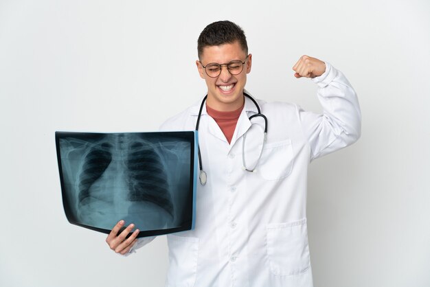 Professional traumatologist on white background doing strong gesture