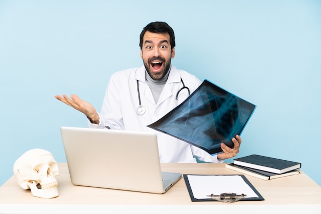 Professional traumatologist in workplace with shocked facial expression