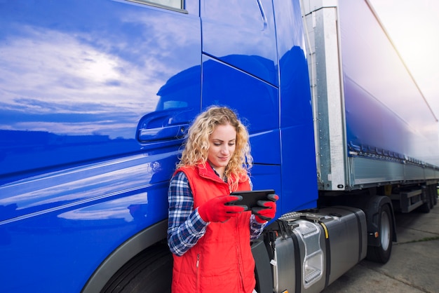 Professional truck driver setting up navigation for destination