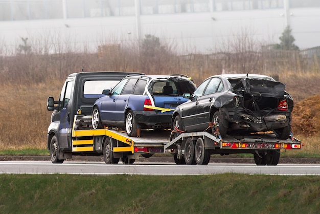 Photo professional vehicle recovery in action tow car truck