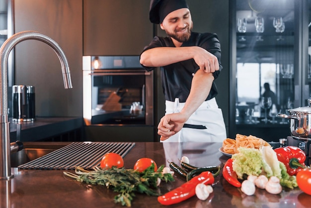 Professional young chef cook in uniform have a busy day on the kitchen