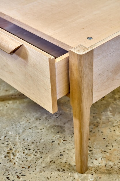 Professionally made wooden nightstand in process of production in workshop Closeup