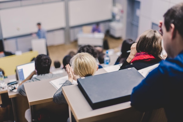 Professor giving presentation in lecture hall at university