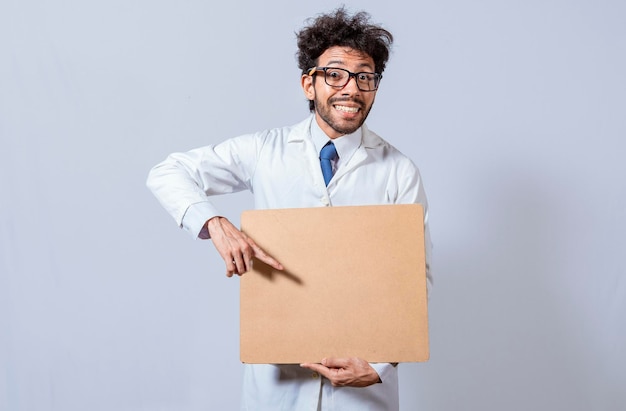 Professor in white coat holding a blank clipboard isolated a\
scientist in a white coat is holding a blank clipboard scientist\
showing and pointing at a blank clipboard