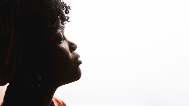 Photo profile of african curly young woman on white background