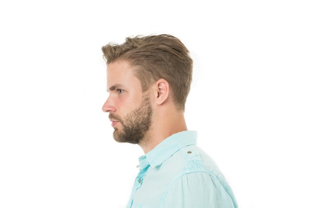 Profile of man with beard on unshaven face isolated on white background Handsome man in blue shirt fashion Bearded and stylish Hair and barber salon Skin care and grooming Casual in style