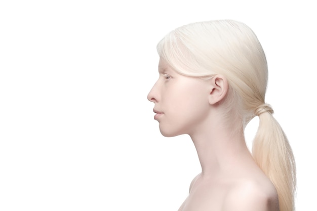 Profile. Portrait of beautiful albino woman isolated on white studio background. Beauty, fashion, skincare, cosmetics concept. Copyspace. Well-kept skin, fresh look. Inclusion and diversity.