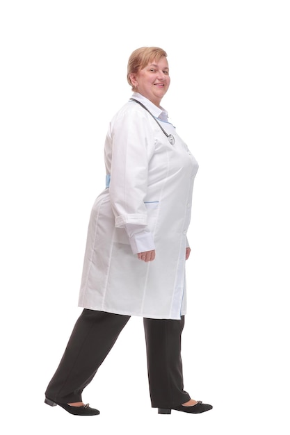 Profile of serious doctor woman walk isolated over white studio