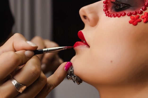 Makeup Artist Painting The Lips