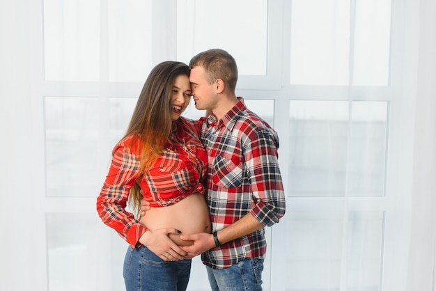 Profile shot of pregnant wife and husband