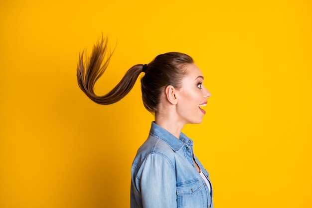 Photo profile side photo of astonished positive girl look good mood wonderful novelty her haircut air wind fly wear style stylish trendy outfit isolated over bright shine color background