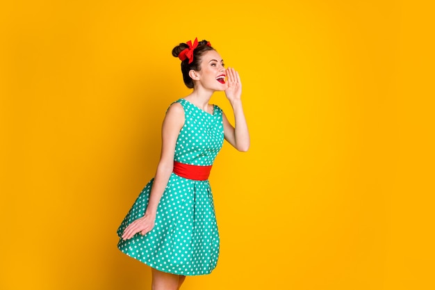 Profile side photo of positive girl hold hand mouth lips scream wear green skirt isolated bright color background