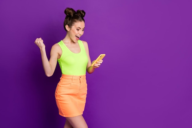 Profile side view portrait of attractive addicted cheerful girl using device share like follow having fun isolated on bright violet color background