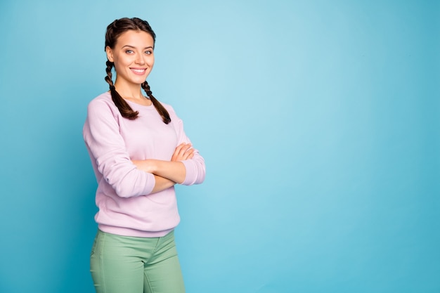 Profile side view portrait of her she nice attractive lovely pretty content cheerful girl folded arms copy space isolated over bright vivid shine vibrant blue green teal turquoise color