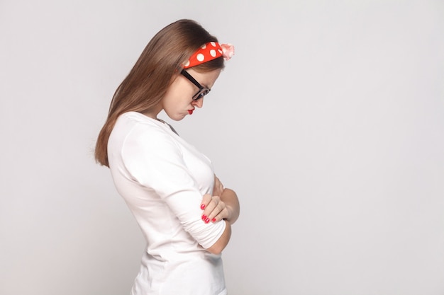 Profile side view of unhappy sad emotional young woman