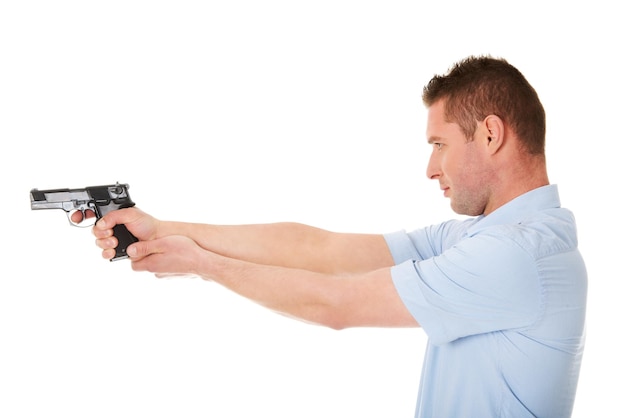 Photo profile view of man aiming gun against white background