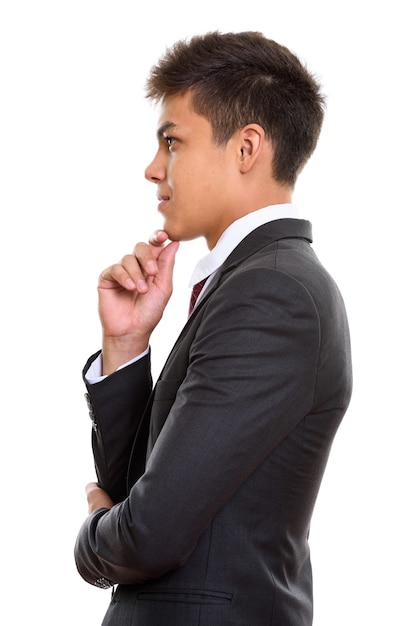 Profile view of young handsome businessman thinking