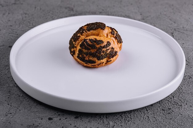 A profiterole french choux pastry covered chocolate chips