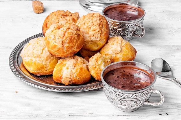 Profiteroles dessert and hot chocolate