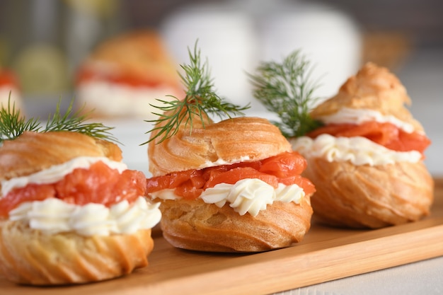 Profiteroles stuffed with cream cheese and salmon.