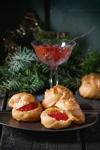 Profiteroles with red caviar