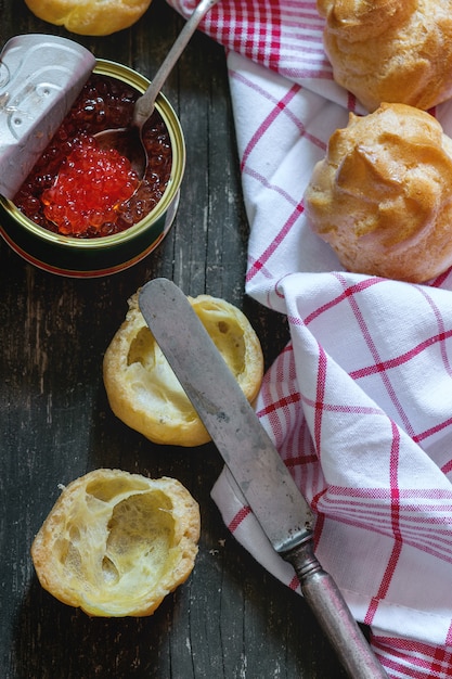 Profiteroles with red caviar