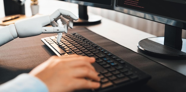 Program coding automation by generative artificial intelligence or AI concept Collaboration between robotic hand and human software developer solving debugging or writing scriptTrailblazing