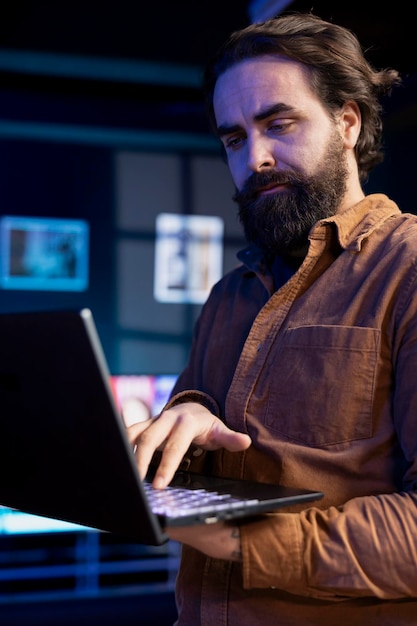 Photo programmer doing software quality assurance reading source code on laptop