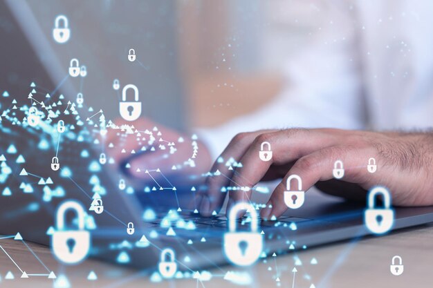 a programmer is typing a code on computer to protect a cyber security from hacker attacks and save clients confidential data padlock hologram icons over the typing hands formal wear