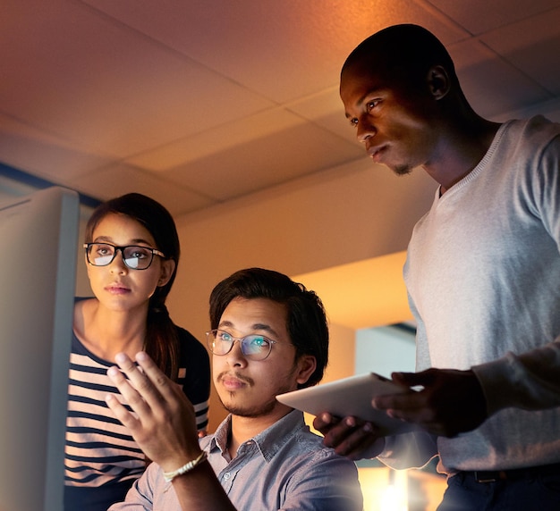 programmer office and computer work at night with staff and database developer team with software development planning conversation and cybersecurity update with it people and web coding strategy
