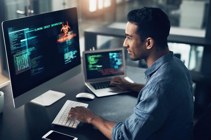 Photo programmer screen and man typing coding and internet connection with digital software computer error and cyber security male person employee or coder with technology big data or cloud computing