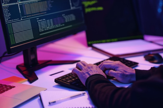 Programmer typing codes on computer