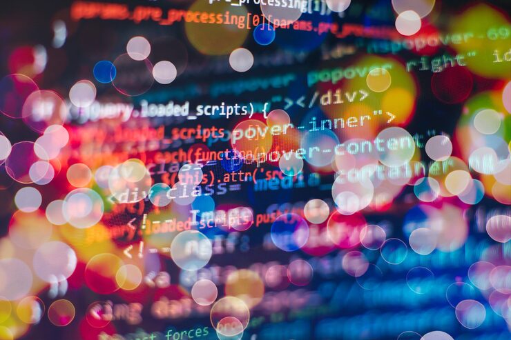 Photo programmer working in a software develop company office. digital binary data on computer screen. computer script typing work. programming code abstract screen of software developer.
