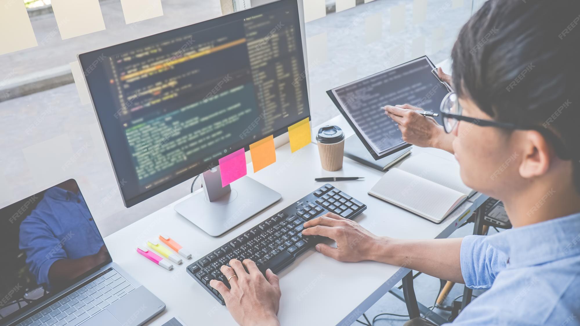 Premium Photo | Programmer working in a software development and coding ...